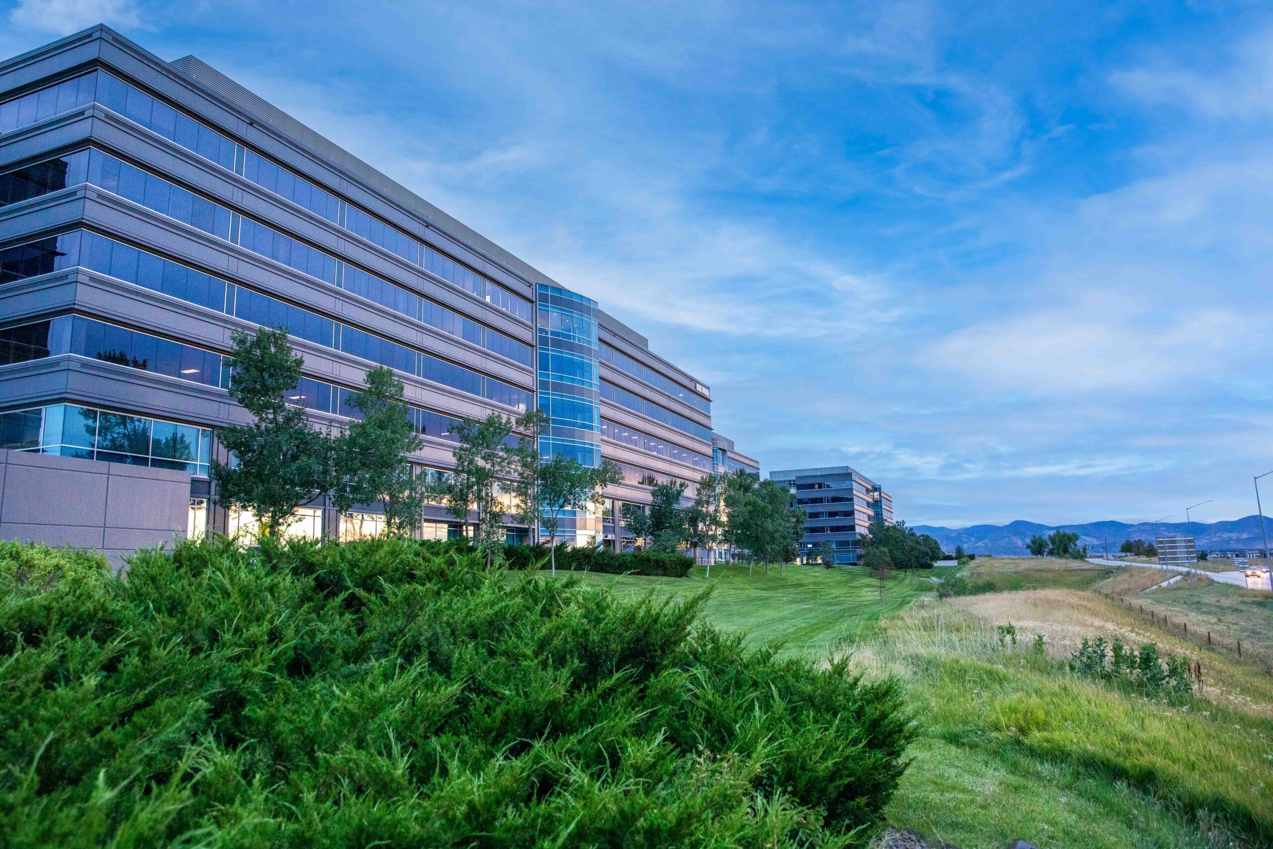 Beauty shot of an office building with mountains in the background